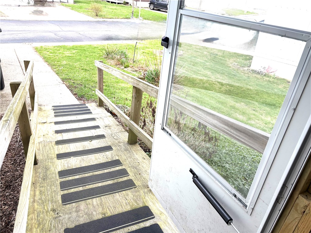 5434 North Waynesville Road, Unit 15 Oregonia, OH 45054 - Photo 18 of 19 This inviting porch entry offers a charming welcome, providing direct access to the vibrant outdoors.
