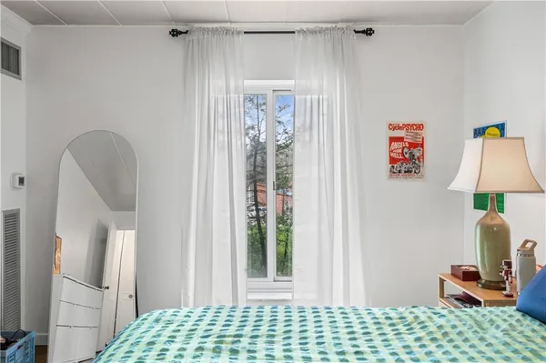 a bedroom with a bed and a table