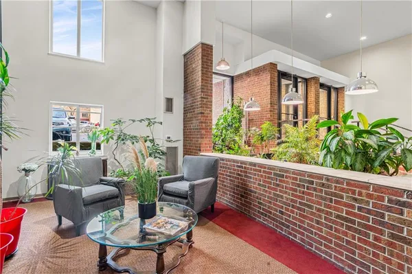 a balcony with furniture and a potted plant