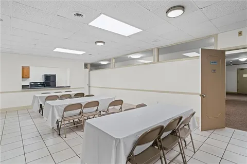 a kitchen that has a table and chairs in it