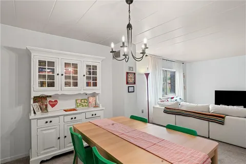 a very nice looking dining room with a table and chairs