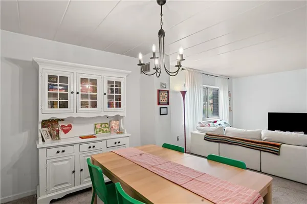 a very nice looking dining room with a table and chairs