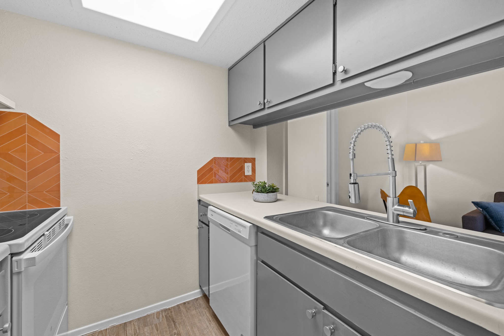 9079 Jollyville Road, Unit 301 Austin, TX 78759 - Photo 28 of 38 #203 A well-appointed kitchen features a stainless steel double sink and modern cabinetry.