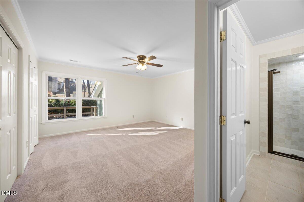 1511 Hemphill Drive Raleigh, NC 27609 - Photo 14 of 37 a view of a livingroom with a ceiling fan and window