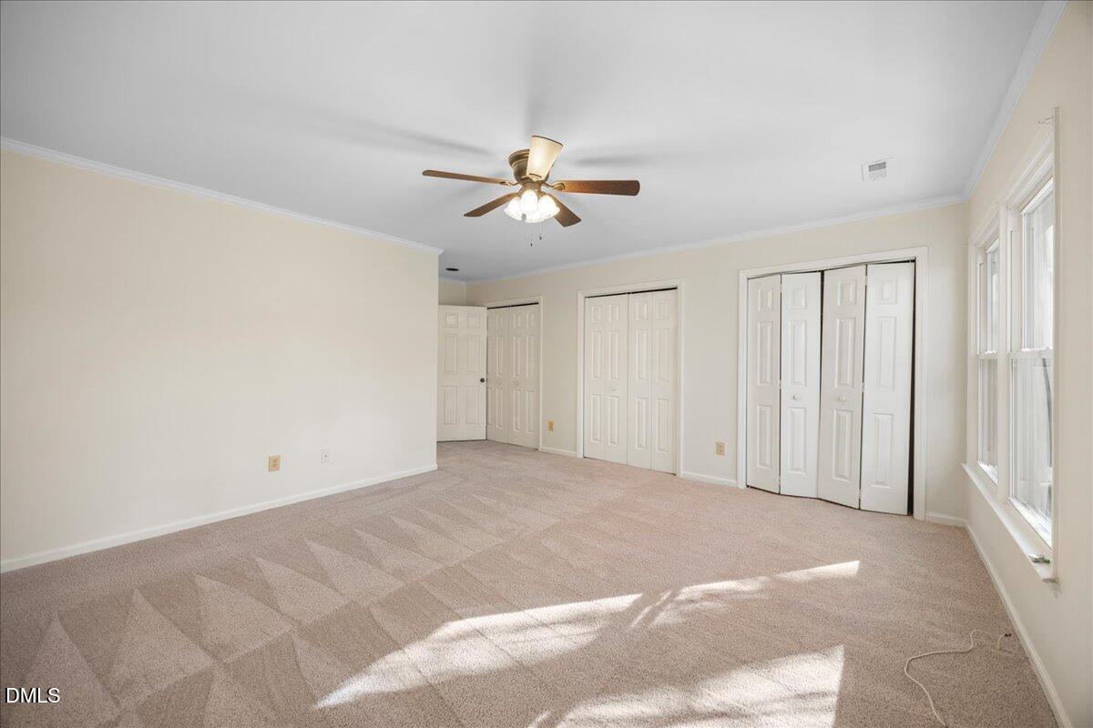 1511 Hemphill Drive Raleigh, NC 27609 - Photo 16 of 37 a view of a room with a ceiling fan and a window