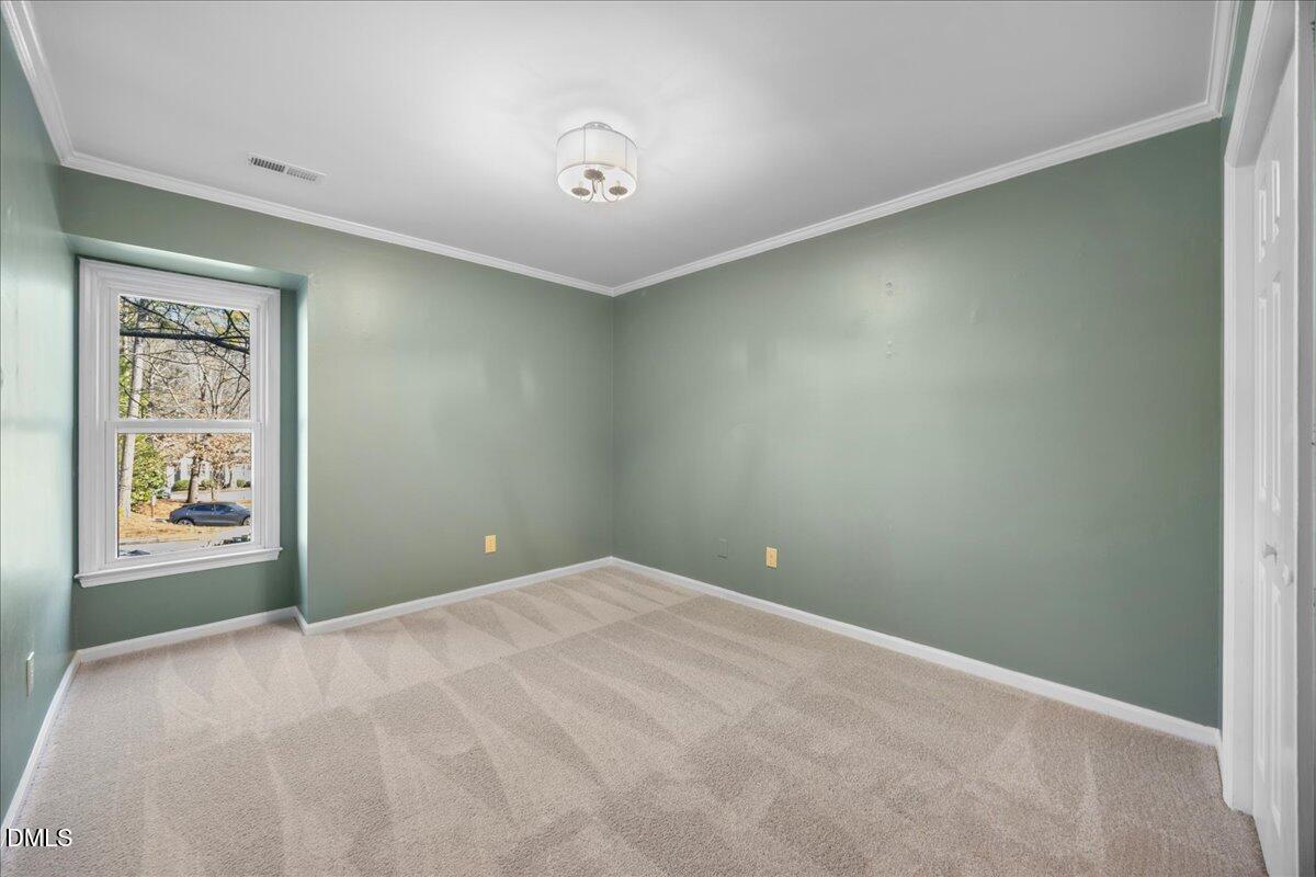 1511 Hemphill Drive Raleigh, NC 27609 - Photo 18 of 37 a view of an empty room with a window