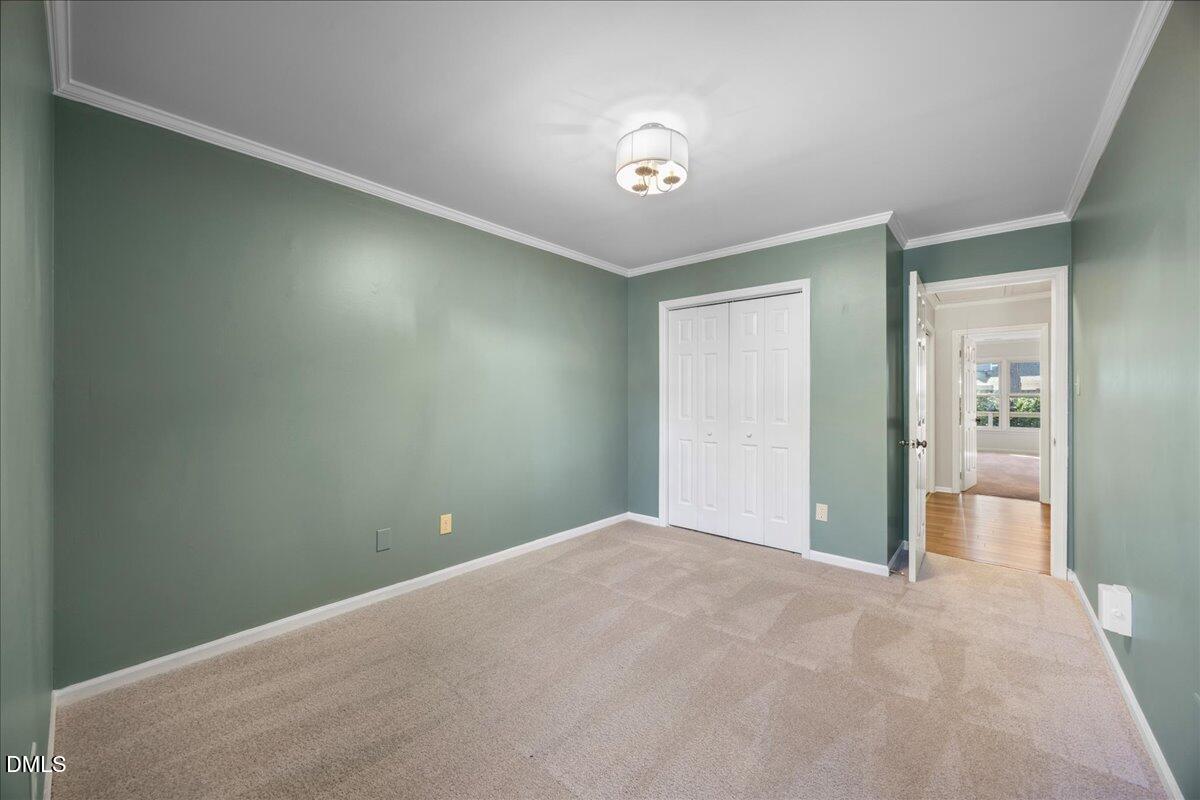 1511 Hemphill Drive Raleigh, NC 27609 - Photo 19 of 37 a view of a big room with closet and windows