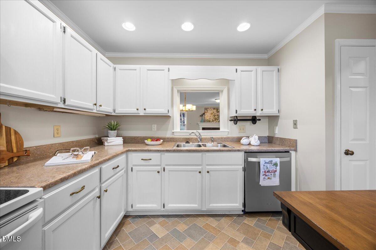 1511 Hemphill Drive Raleigh, NC 27609 - Photo 7 of 37 a kitchen with a sink stove and cabinets