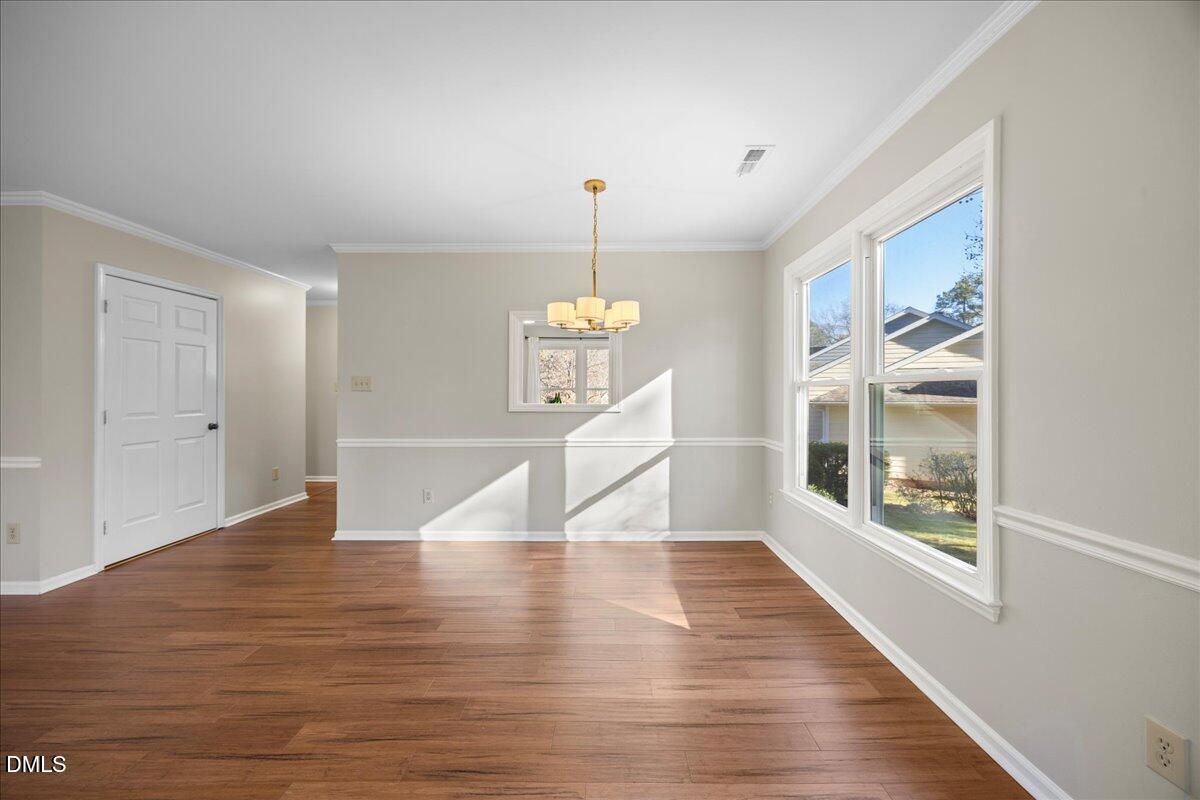 1511 Hemphill Drive Raleigh, NC 27609 - Photo 10 of 37 a view of an entryway with wooden floor