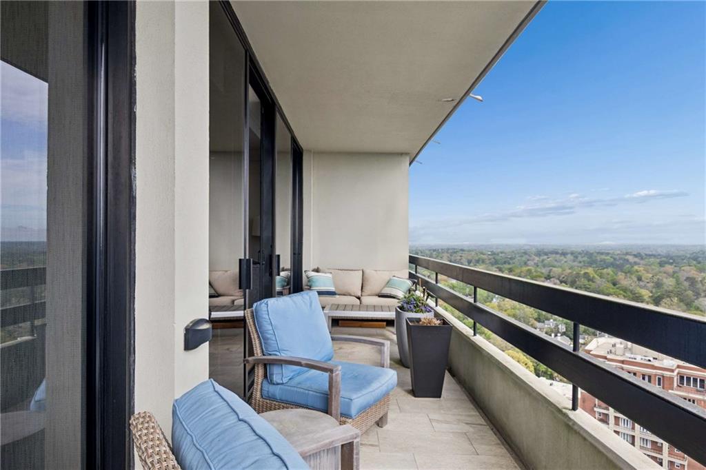 2660 Peachtree Road Northwest, Unit 34F Atlanta, GA 30305 - Photo 27 of 58 a view of a balcony with chairs