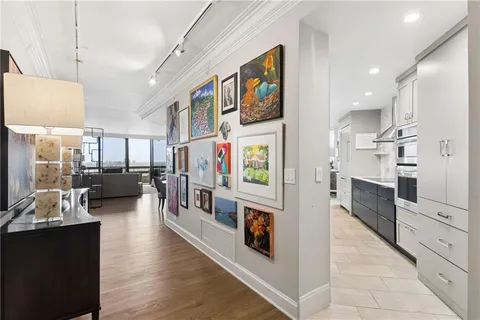 a view of living room kitchen and stainless steel appliances