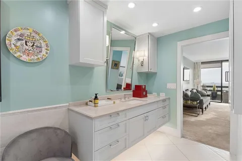 a room with painting and a couch