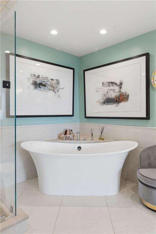 2660 Peachtree Road Northwest, Unit 34F Atlanta, GA 30305 - Photo 38 of 58 a white bath tub sitting in a bathroom