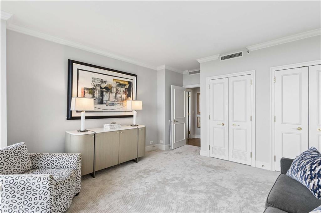 2660 Peachtree Road Northwest, Unit 34F Atlanta, GA 30305 - Photo 40 of 58 a room with painting and a couch