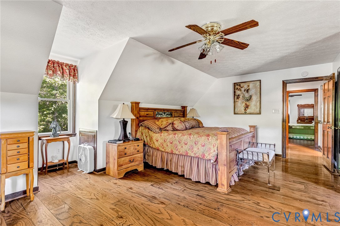 11516 Doswell Road Doswell, VA 23047 - Photo 22 of 50 a bedroom with a bed and a large window