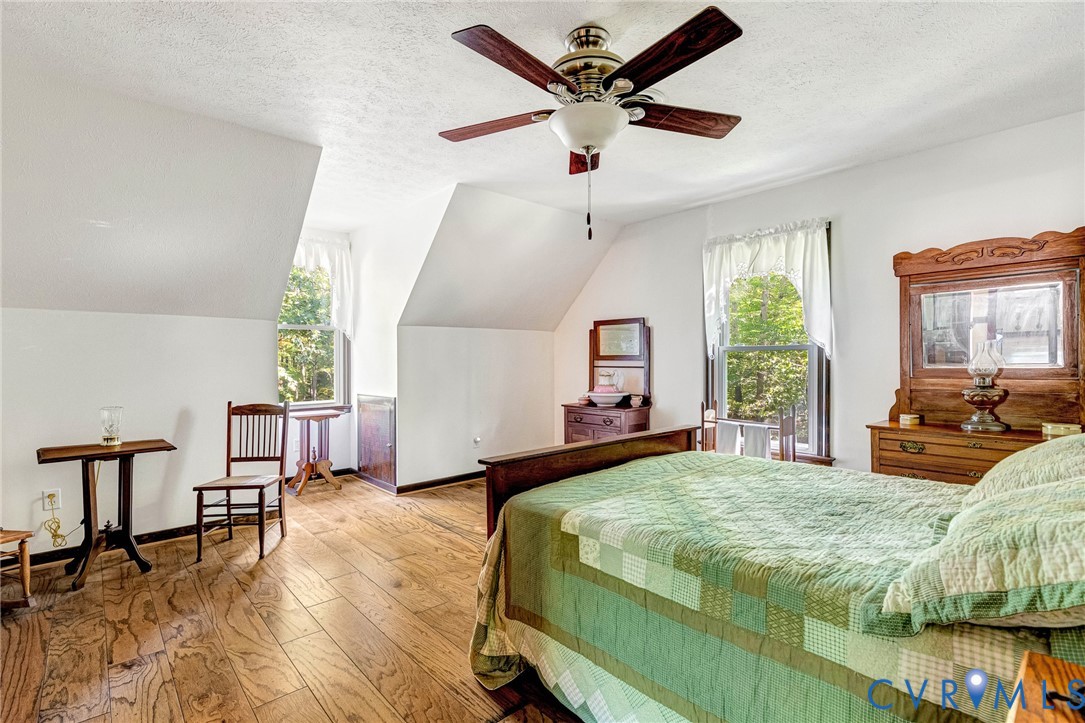 11516 Doswell Road Doswell, VA 23047 - Photo 24 of 50 a bedroom with a bed a large window and furniture