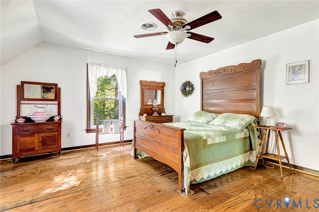 11516 Doswell Road Doswell, VA 23047 - Photo 26 of 50 a bedroom with a bed and a large window