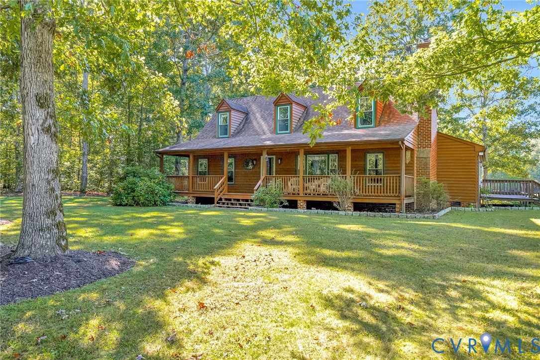 11516 Doswell Road Doswell, VA 23047 - Photo 3 of 50 a front view of a house with a yard table and chairs