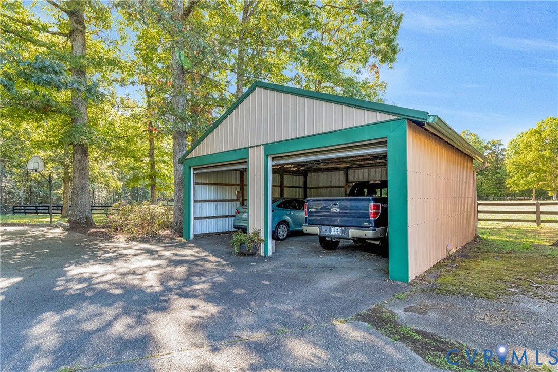 11516 Doswell Road Doswell, VA 23047 - Photo 31 of 50 a view of a house that has a large window and a large tree