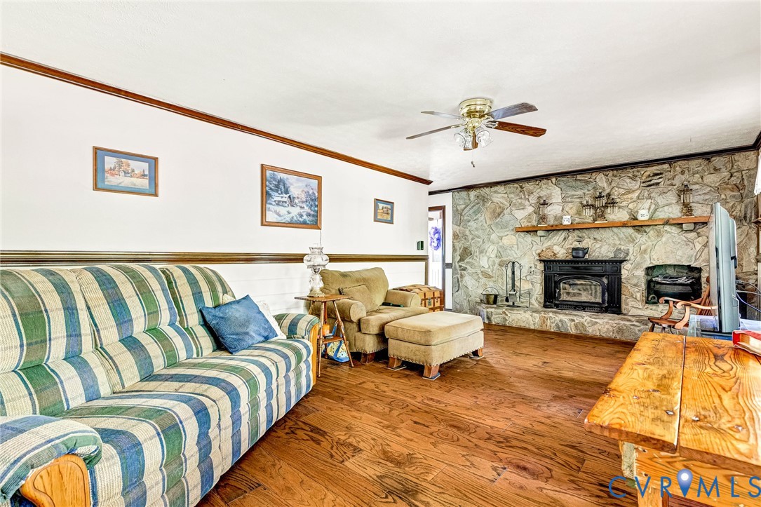 11516 Doswell Road Doswell, VA 23047 - Photo 6 of 50 a spacious bedroom with a bed couch and a fireplace
