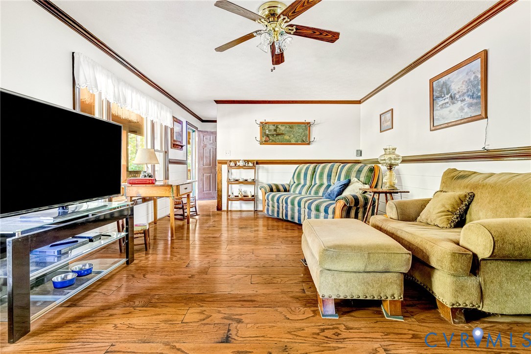 11516 Doswell Road Doswell, VA 23047 - Photo 8 of 50 a living room with furniture and a flat screen tv