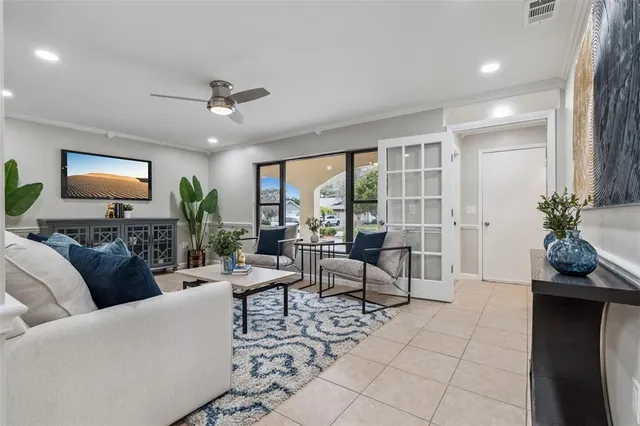 a spacious bedroom with a bed and a painting on the wall