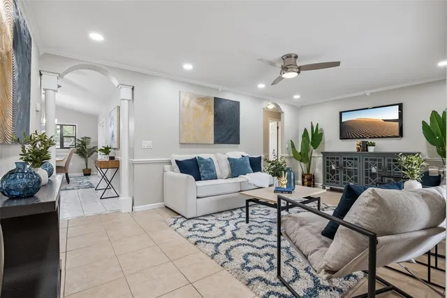 a view of a workspace with a table and a potted plant
