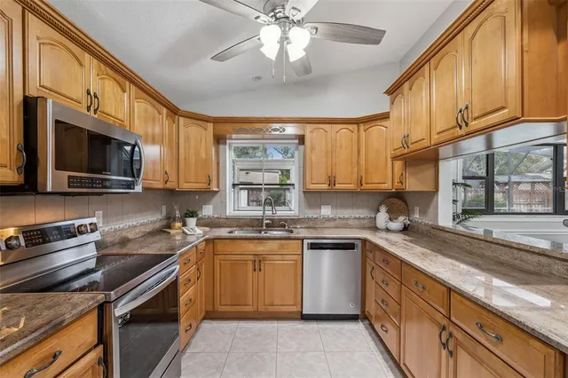 an aerial view of a house with a swimming pool yard and outdoor seating