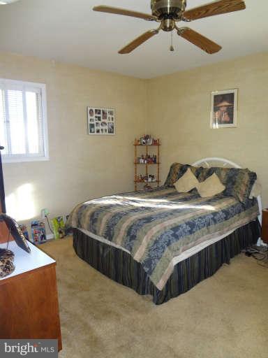 4740 Byron Road Baltimore, MD 21244 - Photo 8 of 12 a bedroom with a bed and window