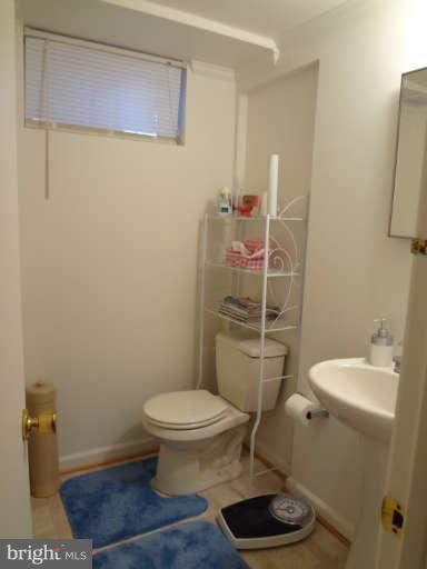 4740 Byron Road Baltimore, MD 21244 - Photo 9 of 12 a bathroom with a toilet and a sink