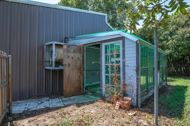 a view of a house with a small garden