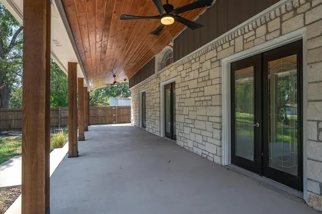 a view of a brick house with a large windows