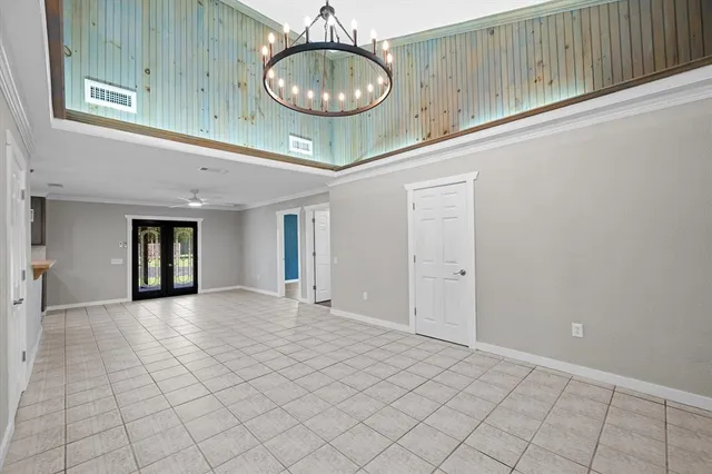 a view of a livingroom with a dishwasher and cabinets
