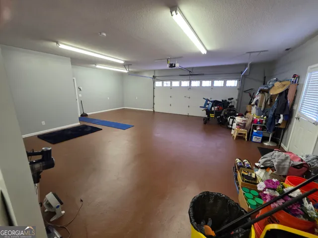 a view of a hallway view with wooden floor and staircase