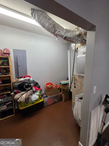 a stove top oven sitting inside of a kitchen