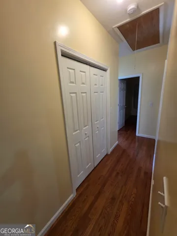 a front view of a house with yard and green space