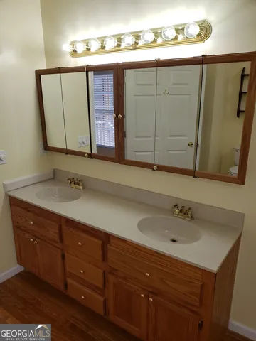 a bathroom with a toilet and a sink
