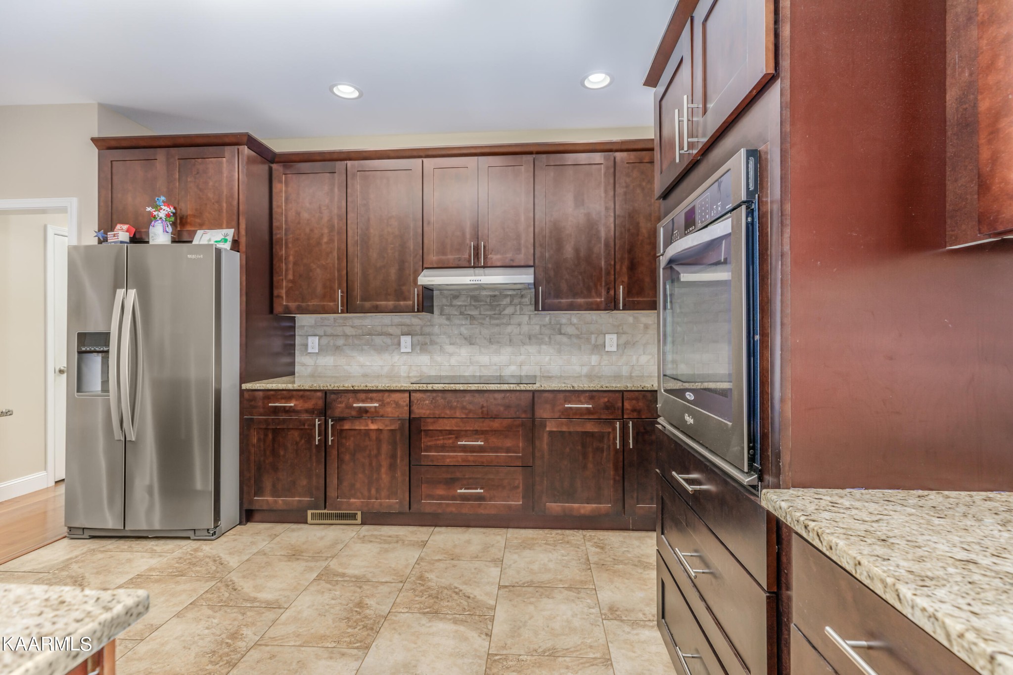 1335 Deep Springs Road Dandridge, TN 37725 - Photo 18 of 30 a kitchen with stainless steel appliances granite countertop a refrigerator and a sink