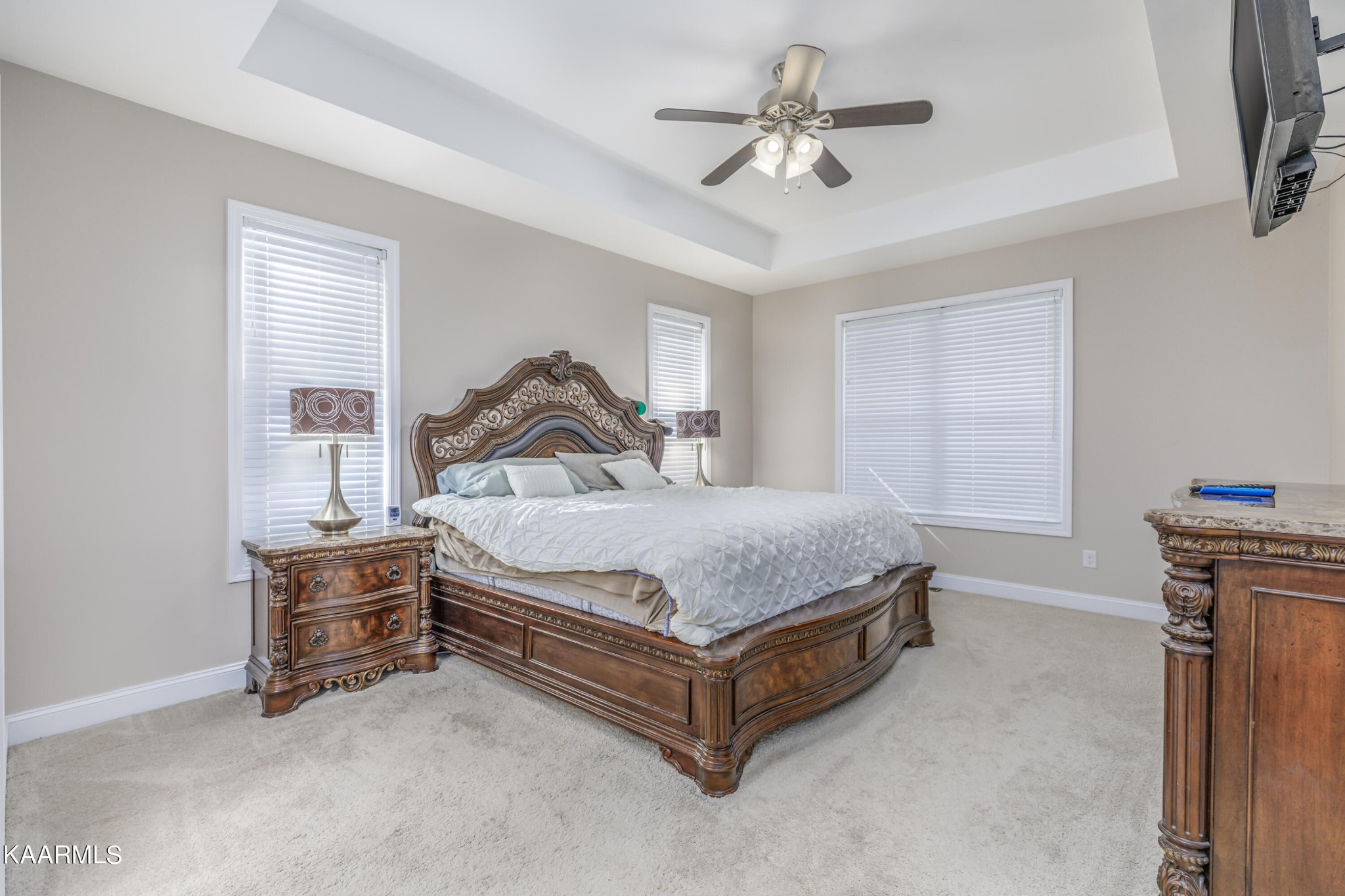 1335 Deep Springs Road Dandridge, TN 37725 - Photo 21 of 30 a bedroom with a bed and a chandelier