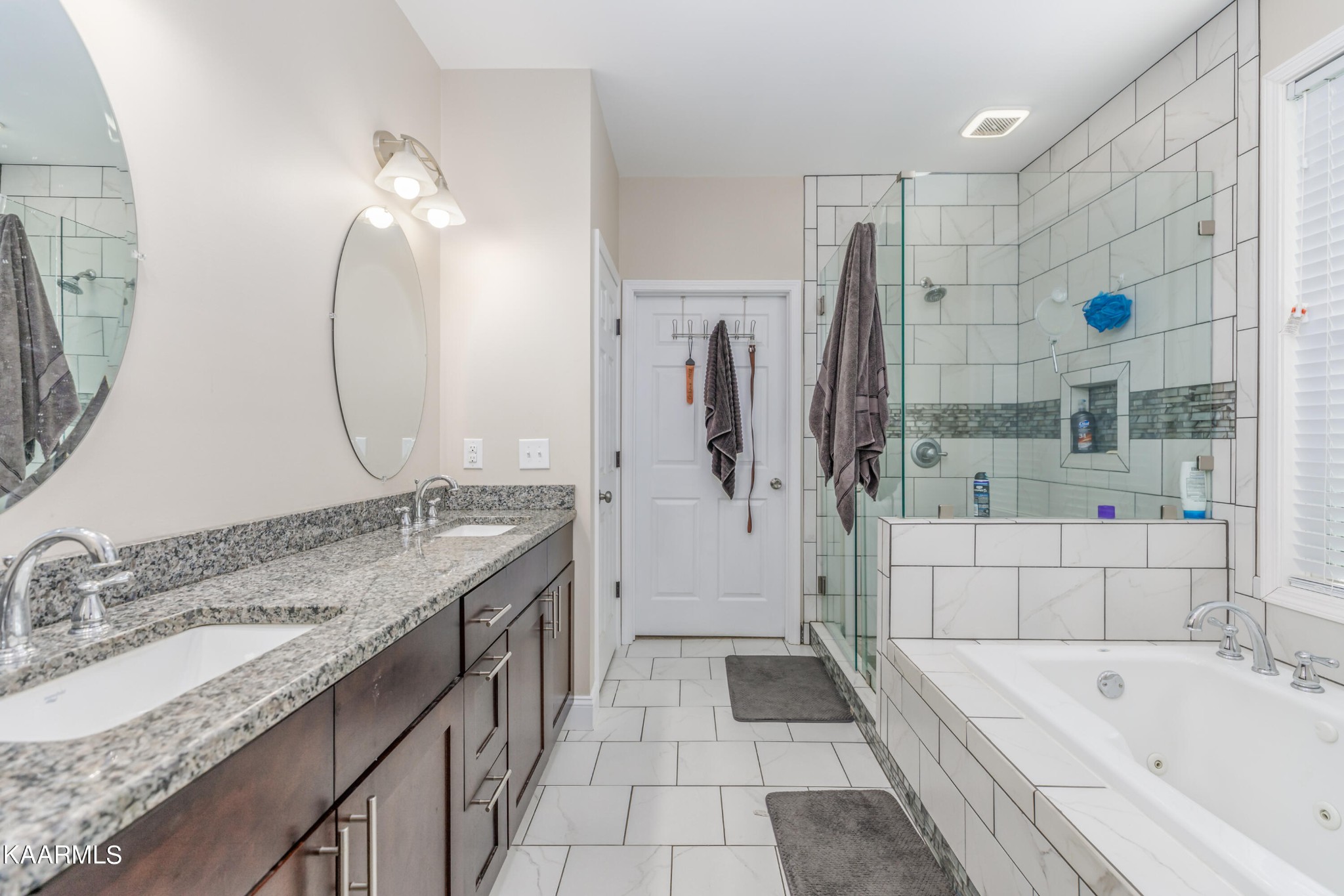 1335 Deep Springs Road Dandridge, TN 37725 - Photo 23 of 30 a bathroom with a granite countertop sink a toilet and shower