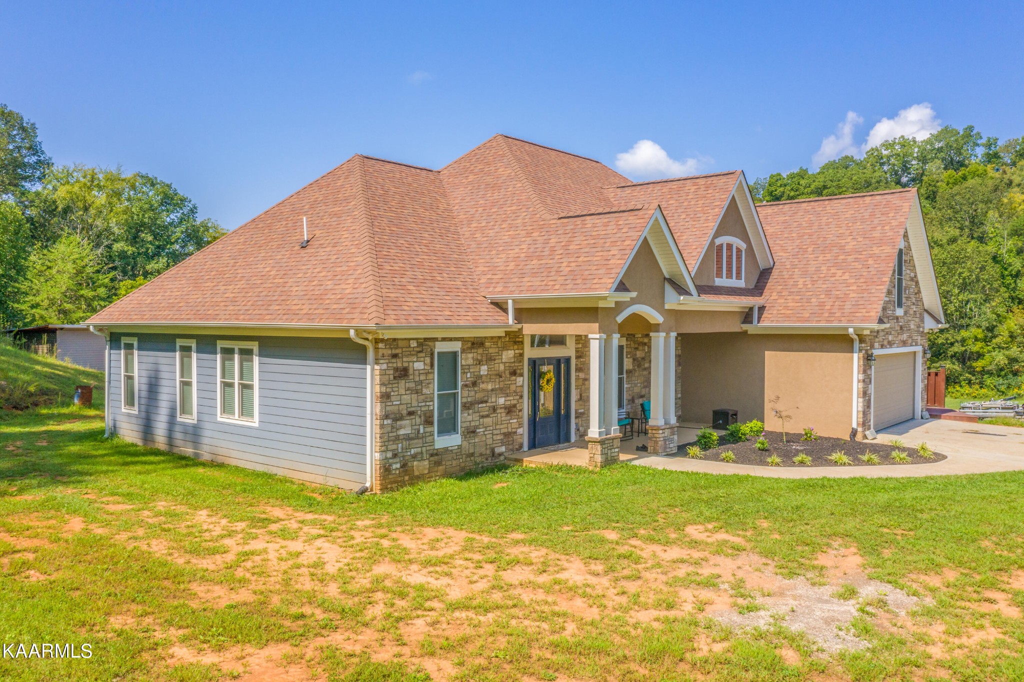 1335 Deep Springs Road Dandridge, TN 37725 - Photo 3 of 30 a front view of a house with a yard