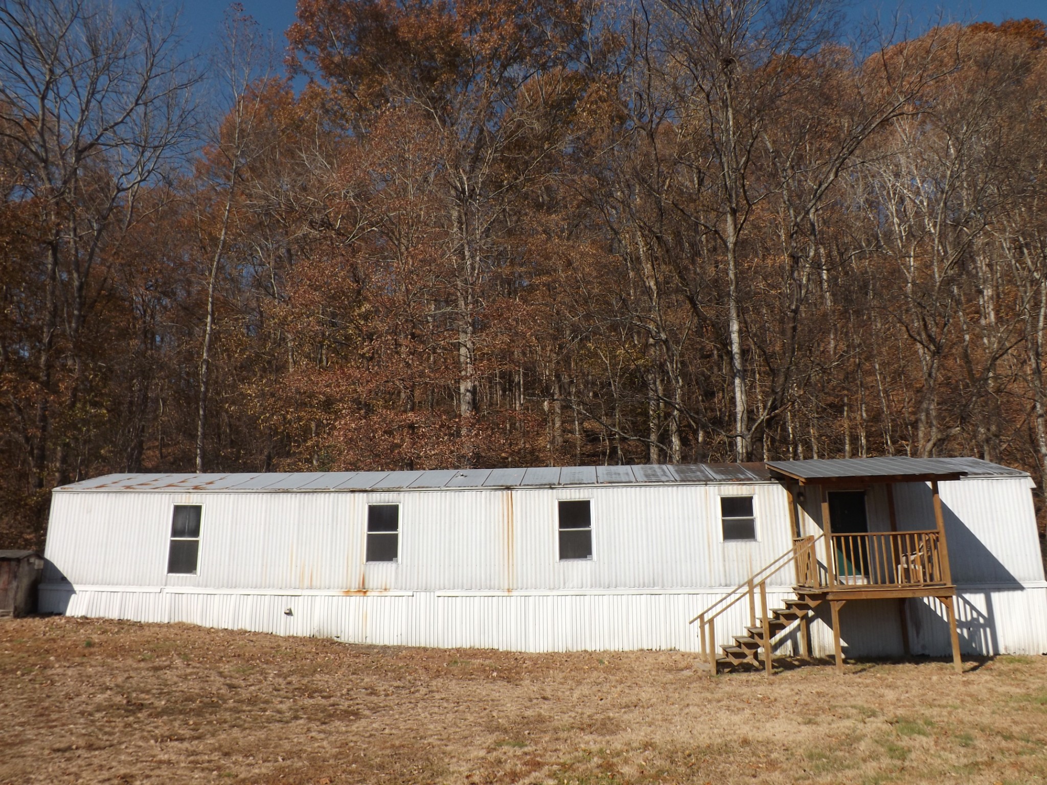 1310 Bevels Spring Road Goodspring, TN 38460 - Photo 1 of 30 a view of a white house with a yard
