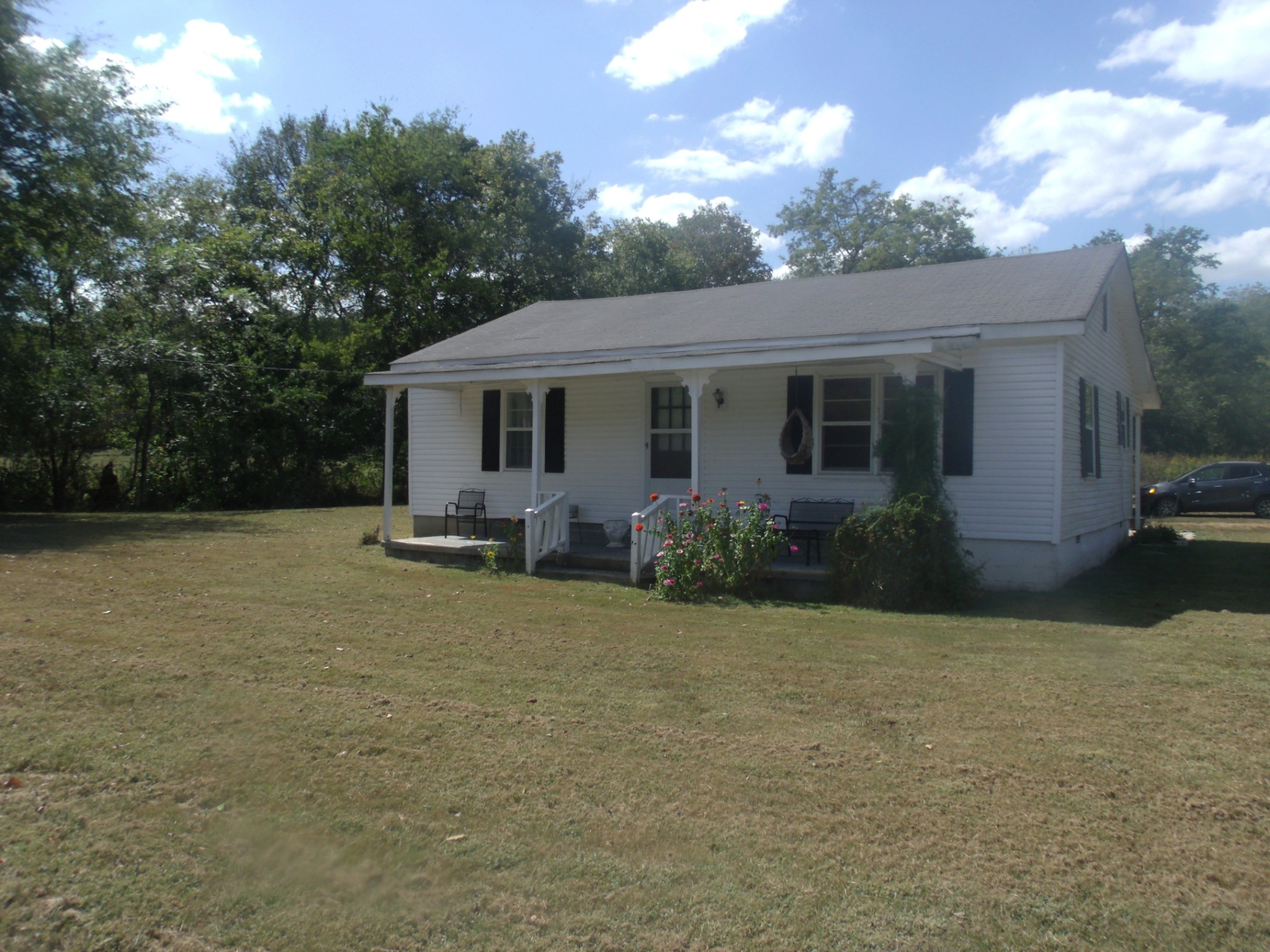 1310 Bevels Spring Road Goodspring, TN 38460 - Photo 15 of 30 a view of a house with backyard and sitting area
