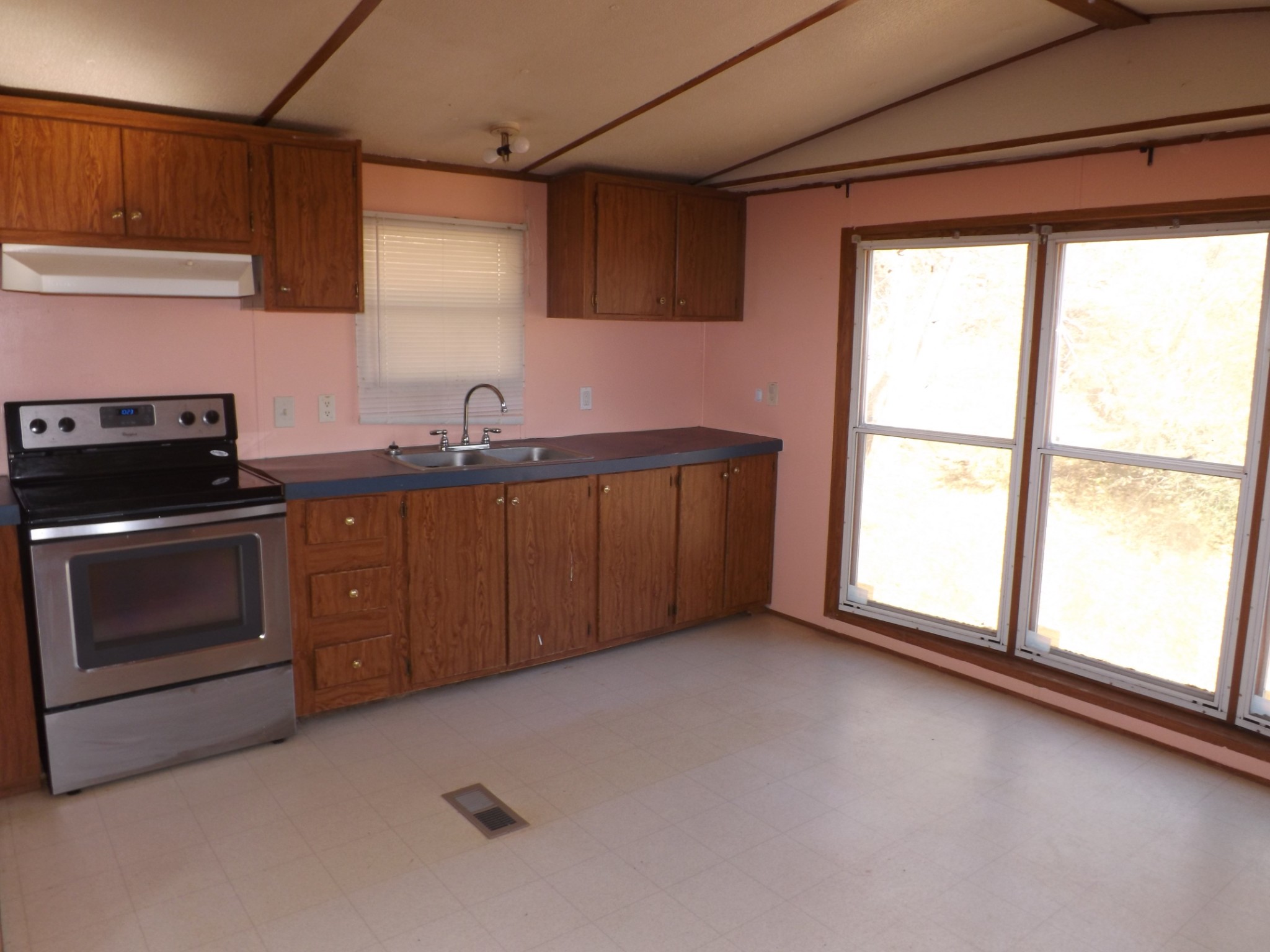 1310 Bevels Spring Road Goodspring, TN 38460 - Photo 4 of 30 a kitchen with a stove microwave and sink