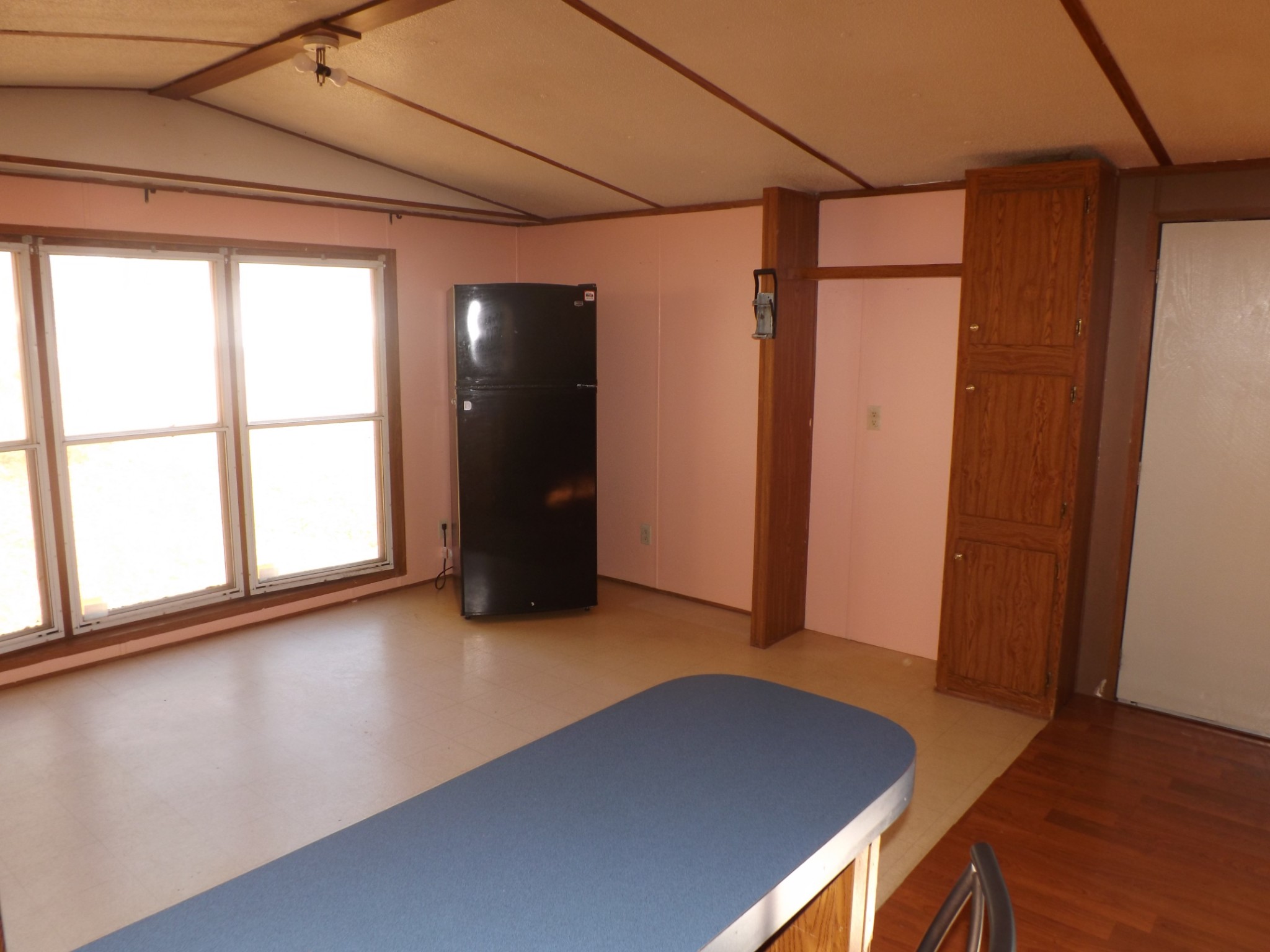 1310 Bevels Spring Road Goodspring, TN 38460 - Photo 5 of 30 an empty room with wooden floor and windows