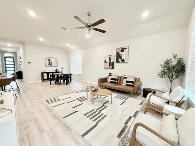 a living room with furniture and a table