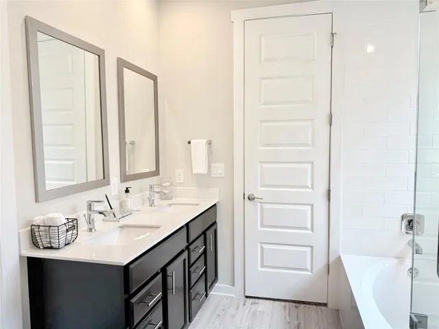 a bathroom with a sink a vanity and a mirror