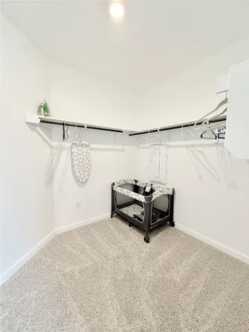 a living room with furniture and a wall painting