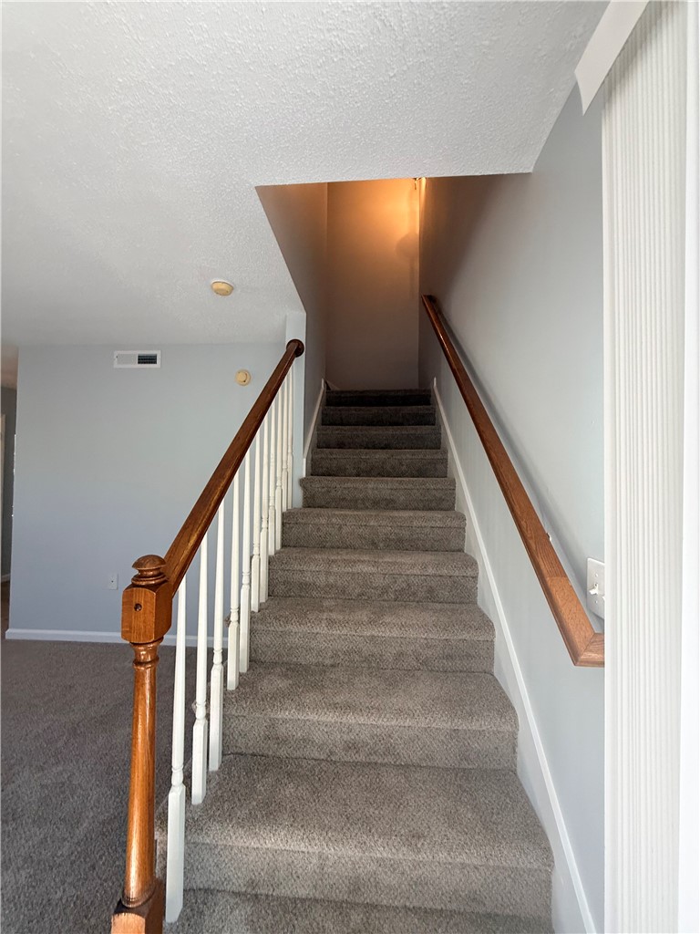 613 Brock Street Central, SC 29630 - Photo 12 of 28 This interior staircase offers seamless transition between living levels.