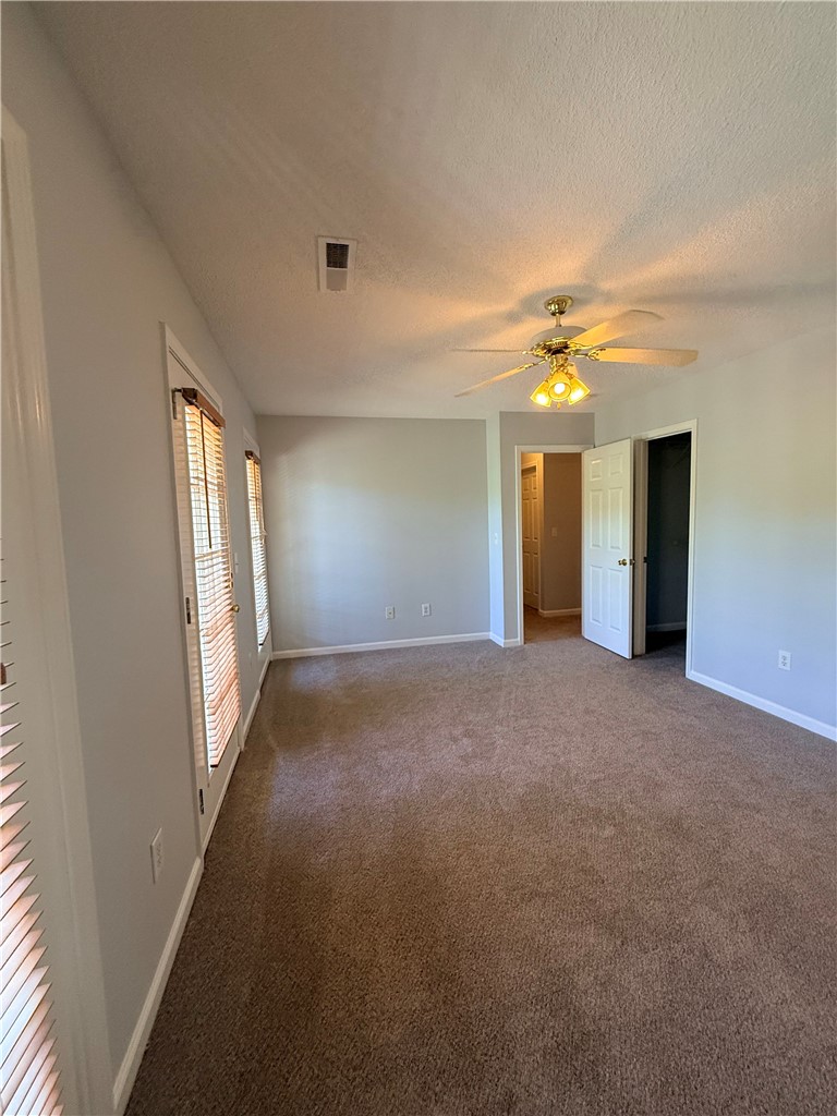 613 Brock Street Central, SC 29630 - Photo 14 of 28 This spacious bedroom offers ample natural light and comfortable carpeting, perfect for peaceful living.